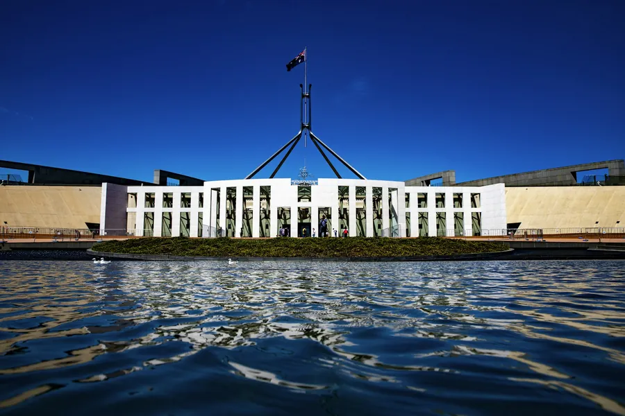Parliament House in Canberra, seen across the water
